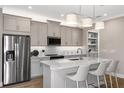 Modern kitchen with stainless steel appliances and island at 4351 Cloud Hopper Way, Lutz, FL 33559