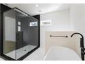 Spa-like bathroom with a large walk-in shower and soaking tub at 1001 E New Orleans Ave, Tampa, FL 33603