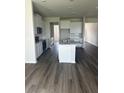 Open kitchen featuring stainless appliances, gray countertops and central island at 16021` 7Th E Ave, Bradenton, FL 34212