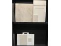 Image displays kitchen tile and cabinetry samples for design selection at 18844 Indian Rock Pl, Lakewood Ranch, FL 34211