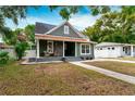 Beautiful craftsman home featuring a cozy front porch and inviting curb appeal at 3506 N Arlington Ave, Tampa, FL 33603