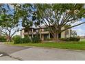 Two-story building with lush landscaping and parking at 10263 Gandy Blvd N Blvd # 2005, St Petersburg, FL 33702