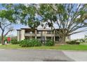 Two-story building with lush landscaping and parking at 10263 Gandy Blvd N Blvd # 2005, St Petersburg, FL 33702