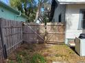 Wooden gate leading to the backyard at 5748 Montana Ave, New Port Richey, FL 34652