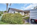 House exterior with gray siding and a carport at 1601 43Rd N St # 114, St Petersburg, FL 33713