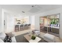 Open kitchen with breakfast bar and access to the backyard patio at 5344 Lowell Ave, Spring Hill, FL 34609