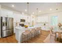 Spacious kitchen with white cabinets, quartz countertops, and stainless steel appliances at 880 17Th S Ave, St Petersburg, FL 33701