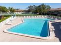 Inviting community pool with plenty of lounge chairs at 9209 Seminole Blvd # 75, Seminole, FL 33772