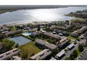 Bird's-eye view of community near the waterfront with tennis courts at 9209 Seminole Blvd # 75, Seminole, FL 33772