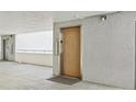 Clean condo building elevator with wood door at 1050 Riverside Dr # A201, Palmetto, FL 34221