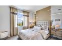 Spacious bedroom with large window, plush bed, and stylish nightstands at 18006 Tavernside Trl, Lakewood Ranch, FL 34211
