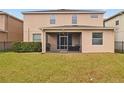 Two-story house with screened patio and fenced backyard at 2811 Maple Brook Loop, Lutz, FL 33558