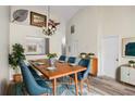 Spacious dining room with an elegant chandelier, stylish furniture, and tasteful decor at 3454 Hillmoor Dr, Palm Harbor, FL 34685