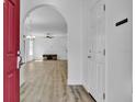 Open-concept living room with light colored, wide plank floors at 411 S Fremont Ave # B, Tampa, FL 33606