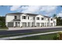 Exterior view of a row of townhouses with gray siding and green garage doors at 1566 Hammer Pl, Clearwater, FL 33756