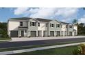 Exterior view of a row of townhouses with gray siding and green garage doors at 1566 Hammer Pl, Clearwater, FL 33756