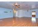 Spacious living area with wood flooring and light walls at 33137 Cercelia Rd, Dade City, FL 33523