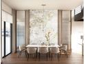 Elegant dining room features a modern chandelier, marble accent wall, and water views from large windows at 4441 Pompano Se Dr, St Petersburg, FL 33705