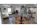 Open living and kitchen area with white cabinets at 4614 Webster St, Tampa, FL 33610