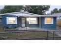 Newly painted blue house with a chain-link fence at 4614 Webster St, Tampa, FL 33610