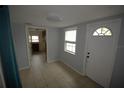 Home entryway with view into kitchen and laundry at 2234 36Th N Ave, St Petersburg, FL 33713