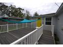 Back deck with shade sail and white railing at 2234 36Th N Ave, St Petersburg, FL 33713