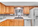 Updated kitchen with wood cabinets and stainless steel appliances at 3078 Eastland Blvd # 304, Clearwater, FL 33761