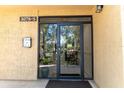 Condo building entrance with glass doors at 3078 Eastland Blvd # 304, Clearwater, FL 33761