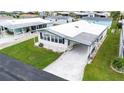 Aerial view of a single-wide manufactured home in a community at 37617 Amigo Dr, Zephyrhills, FL 33541