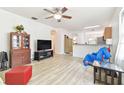 Bright living room with hardwood floors and open layout at 7734 Bristol Park Dr, Apollo Beach, FL 33572