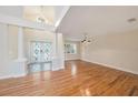 Bright entryway with hardwood floors, double doors, and a high ceiling at 13811 Shady Shores Dr, Tampa, FL 33613