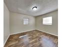 Simple bedroom with wood-look flooring at 315 Lime Tree Rd, Tampa, FL 33619