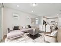 Bright living room showcases an open floor plan with stylish furnishings and lots of natural light at 9434 Shorebird Ct, Parrish, FL 34219