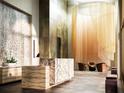 Impressive lobby area with a large stone reception desk and a unique hanging light fixture at 126 4Th Ne Ave # 1302, St Petersburg, FL 33701