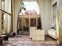 Grand lobby entrance with floor-to-ceiling windows, marble accents and modern furnishings at 126 4Th Ne Ave # 1302, St Petersburg, FL 33701