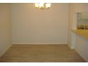 Dining area with light walls and vinyl plank flooring at 3161 Lake Pine S Way # B1, Tarpon Springs, FL 34688