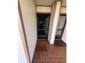 Private condo entrance with a welcoming doormat at 6268 Palma Del Mar Blvd S # 215, St Petersburg, FL 33715