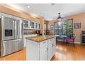 Kitchen features island, stainless steel appliances, and granite countertops at 1858 Longview Ln, Tarpon Springs, FL 34689