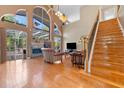 Bright living room with hardwood floors, fireplace and high ceilings at 1858 Longview Ln, Tarpon Springs, FL 34689