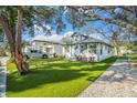 Front yard view of a charming house with artificial turf at 2227 21St S St, St Petersburg, FL 33712