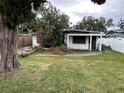 House with tree damage in front yard at 3108 W Ballast Point Blvd, Tampa, FL 33611