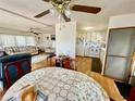Open concept dining area with kitchen and living room views at 34539 Violet N Dr, Pinellas Park, FL 33781