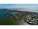 Panoramic aerial view showcasing the property's waterfront location and proximity to the bay and coastal community at 15918 Redington Dr, Redington Beach, FL 33708