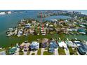 Waterfront home with boat dock on a canal leading to the open bay with a beautiful view of the city skyline at 15918 Redington Dr, Redington Beach, FL 33708