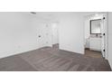 Bright bedroom with carpet flooring and an ensuite bathroom at 29650 Fedora Cir, Brooksville, FL 34602