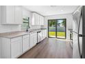 Modern kitchen with granite countertops and stainless steel appliances at 29650 Fedora Cir, Brooksville, FL 34602