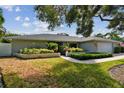 Charming single-story home with well-manicured lawn and mature trees at 5104 W San Jose St, Tampa, FL 33629