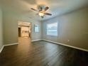 Bright dining room features hardwood floors and an open view to the kitchen at 1306 Bonnie Rd, Plant City, FL 33563