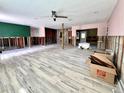 Under construction room with new wood-look floor at 311 80Th Ne Ave, St Petersburg, FL 33702