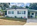 Single wide mobile home with carport and landscaping at 37308 Kinkaid Dr, Zephyrhills, FL 33541